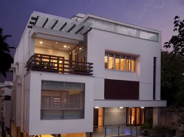 a white house with a balcony