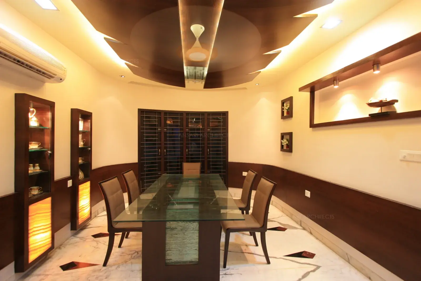 View of dining room from the entrance showing the decorative wooden false ceiling and wall panelling.