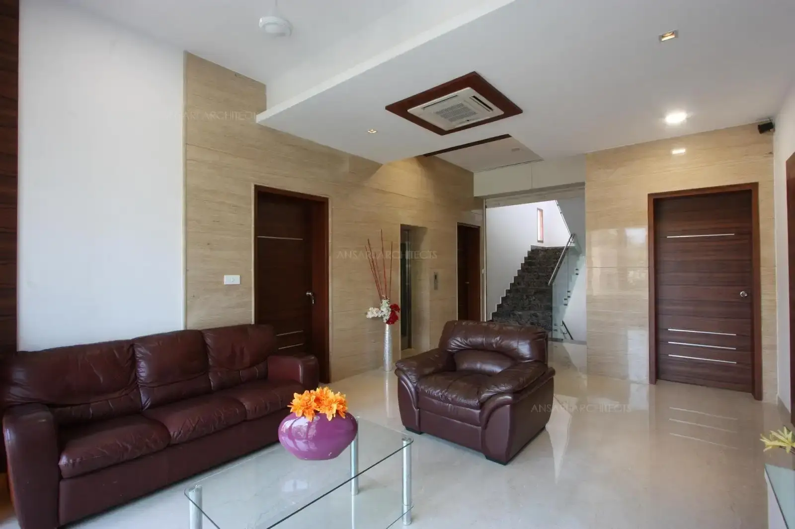 The family room is space luxury of and comfort. Vibrant and relaxed seatings with abundant natural light. Recessed lights light up the room. Clean layout and defined decor come together to create a special space to unwind and relax. Accessories are kept to a minimum for an uncluttered look.