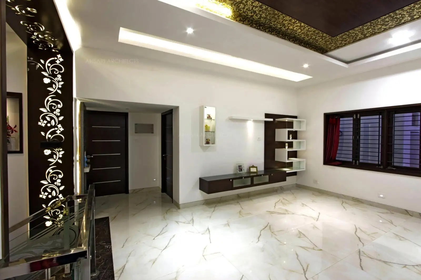 The staircase landing space acts as a overwhelming gesture with the decor, gold lining offset for the ceiling provides a royal look.