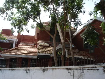 a house with a fence and trees