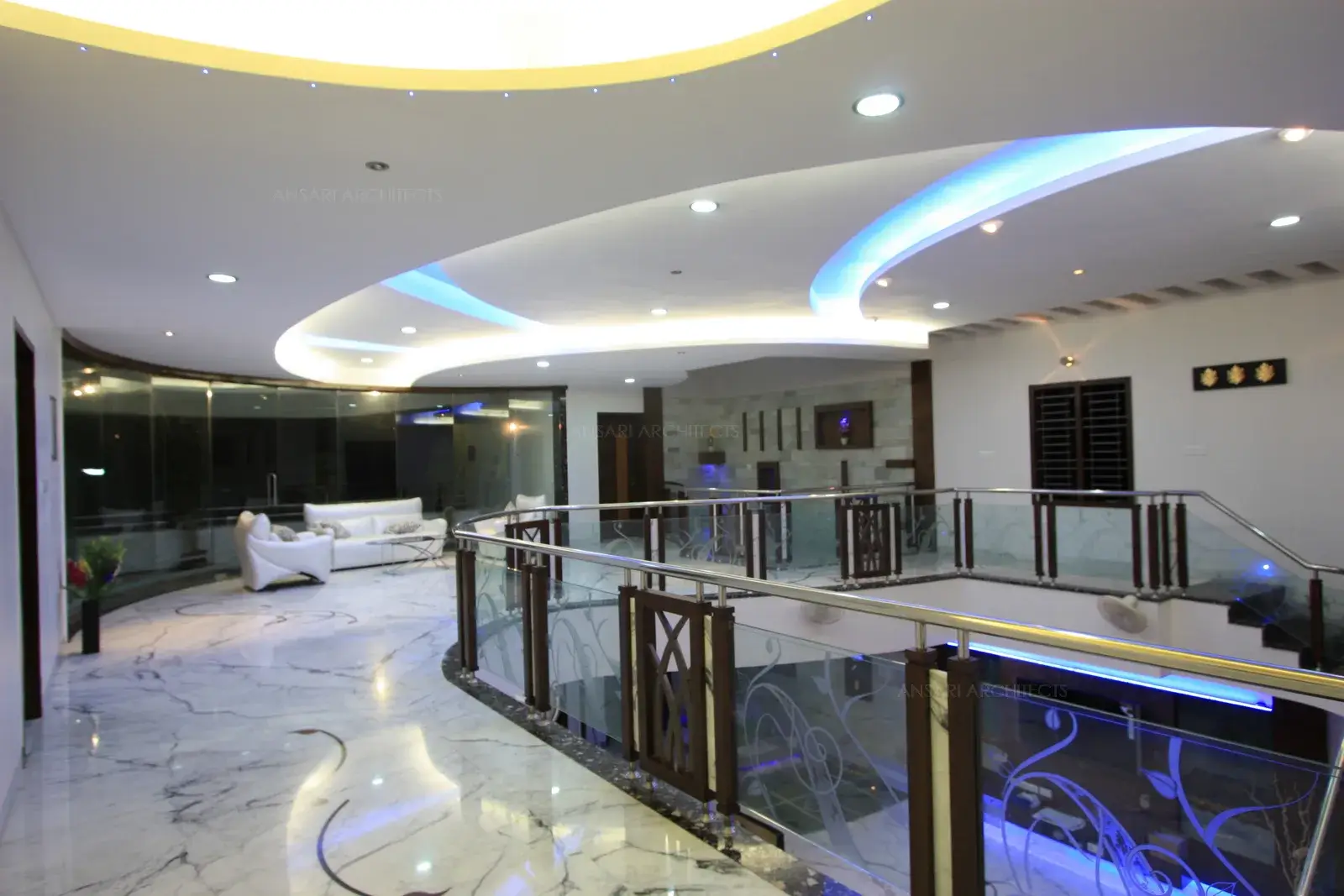 View of first floor common area showing the handrails and the false ceiling.
